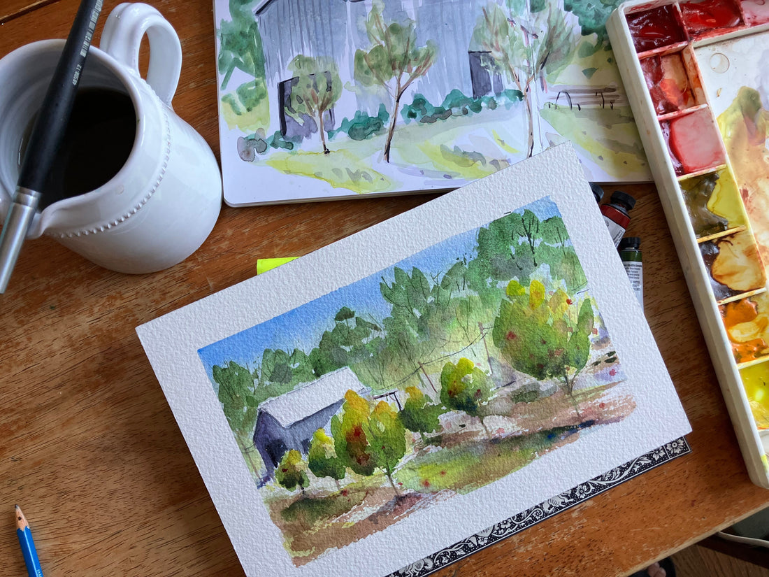 Finished watercolor painting of a barn in apple orchard inspired by a sketchbook painting of Calico Cidery in Julian California